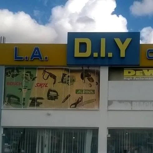 The yellow and blue L.A D.I.Y shop front with Bosch, Skil and Alpina posters